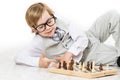 Child Playing Chess, Smart Kid Boy in Business Suit Glasses Play Royalty Free Stock Photo