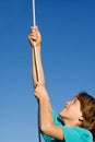 Child playing climbing rope