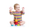 Child playing with color pyramid toy Royalty Free Stock Photo