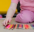 Child playing with colored pencils Royalty Free Stock Photo