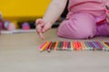 Child playing with colored pencils Royalty Free Stock Photo