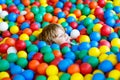 Child playing at colorful plastic balls playground Royalty Free Stock Photo