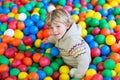 Child playing at colorful plastic balls playground Royalty Free Stock Photo