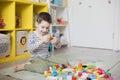 Child playing with colorful toy blocks Royalty Free Stock Photo