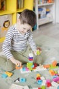 Child playing with colorful toy blocks Royalty Free Stock Photo