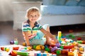 Child playing with colorful toy blocks. Kids play Royalty Free Stock Photo