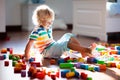 Child playing with colorful toy blocks. Kids play Royalty Free Stock Photo