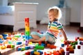 Child playing with colorful toy blocks. Kids play Royalty Free Stock Photo