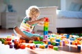 Child playing with colorful toy blocks. Kids play Royalty Free Stock Photo