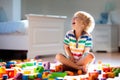 Child playing with colorful toy blocks. Kids play Royalty Free Stock Photo