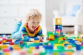 Child playing with toy blocks. Toys for kids. Royalty Free Stock Photo