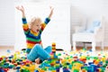 Child playing with toy blocks. Toys for kids. Royalty Free Stock Photo