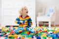 Child playing with toy blocks. Toys for kids. Royalty Free Stock Photo