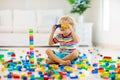 Child playing with toy blocks. Toys for kids Royalty Free Stock Photo