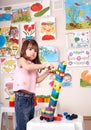 Child playing construction set in play room. Royalty Free Stock Photo