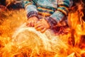 child playing a djembe drum with natural goat fur features. Fire effect.