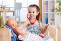 Child playing doctor with toy at home Royalty Free Stock Photo