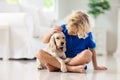 Child playing with dog. Kids play with puppy Royalty Free Stock Photo