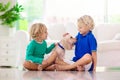 Child playing with dog. Kids play with puppy Royalty Free Stock Photo