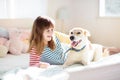 Child playing with dog. Kids play with puppy Royalty Free Stock Photo