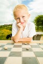 Child playing draughts or checkers board game outdoor Royalty Free Stock Photo