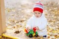 child playing excavator on the street