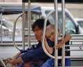 A child playing with father on street in Mandalay, Myanmar Royalty Free Stock Photo