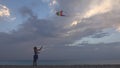 Child Playing Flying Kite on Beach at Sunset, Happy Little Girl on Coastline Royalty Free Stock Photo