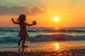 child playing with a frisbee on a beach with a sunset in the background Royalty Free Stock Photo