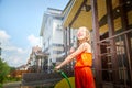 Child playing with garden sprinkler. Summer outdoor water fun in backyard. Ggirl play with hose watering grass. Kid Royalty Free Stock Photo