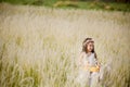 Child playing guitar to meadow outdoor in nature