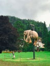 Child playing with the hanging elephant art in Bad Ragaz, Switzerland