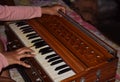 Child playing Harmonium a musical instrument