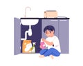 Child playing with kitchen detergents at home. Kid with cleaning chemical products, toxic cleansers, dangerous liquids