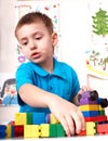 Child playing lego block and construction set. Royalty Free Stock Photo