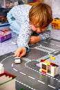 Child playing with Lego in his room Royalty Free Stock Photo