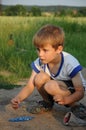 Child playing marbles