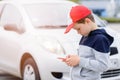 Child playing mobile games on smartphone on the street