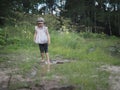 A child playing in a muddy puddle. Royalty Free Stock Photo