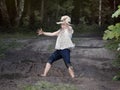 A child playing in a muddy puddle. Royalty Free Stock Photo