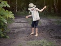 A child playing in a muddy puddle. Royalty Free Stock Photo