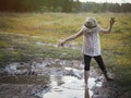 A child playing in a muddy puddle. Royalty Free Stock Photo