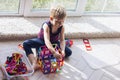 The child is playing with a multi-colored magnetic constructor, building a tower. Educational toys . A building block for a baby Royalty Free Stock Photo