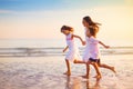 Child playing on ocean beach. Kid at sunset sea Royalty Free Stock Photo