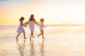 Child playing on ocean beach. Kid at sunset sea Royalty Free Stock Photo