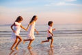 Child playing on ocean beach. Kid at sunset sea Royalty Free Stock Photo