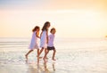 Child playing on ocean beach. Kid at sunset sea Royalty Free Stock Photo