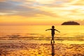 Child playing on ocean beach. Kid at sunset sea Royalty Free Stock Photo