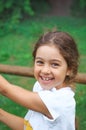 Child playing on outdoor playground. Kids plays on school or kindergarten yard.  Healthy summer activity for children in sunny Royalty Free Stock Photo