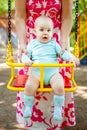 Child playing on outdoor playground. Little baby boy with parent plays on school or kindergarten yard. Active kid on colorful Royalty Free Stock Photo